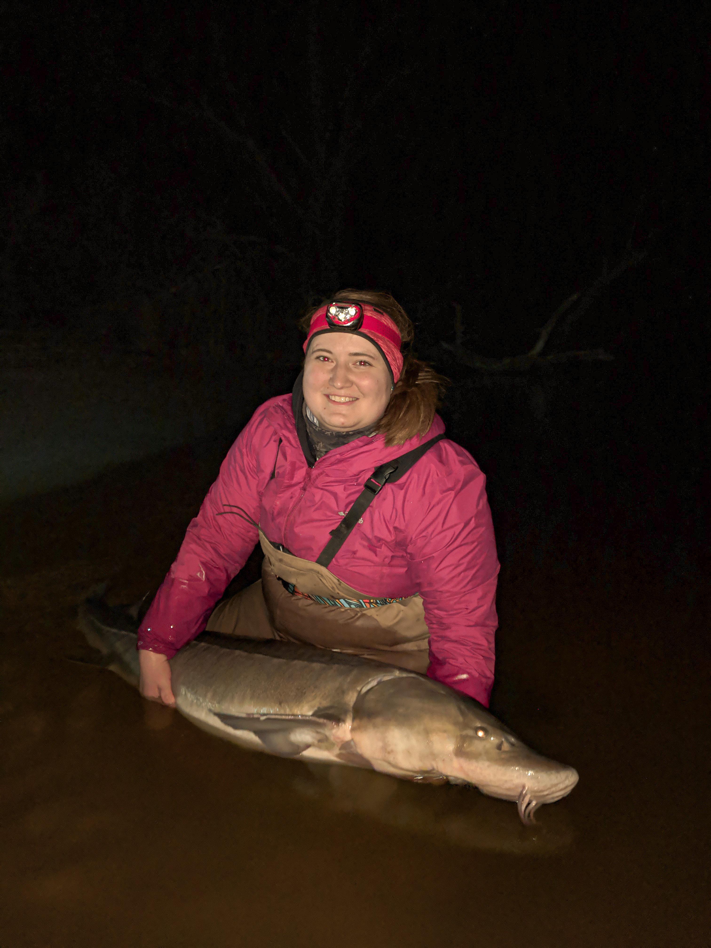 Kelsey Bockelman holding lake sturgeon